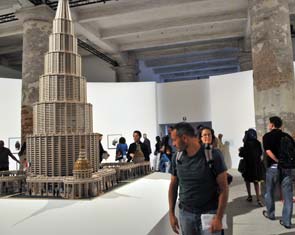 An 11-foot-tall architectural model (The Encyclopedic Palace) by Marino Auriti, a self-taught Italian-American artist, is the centerpiece of the Biennale.