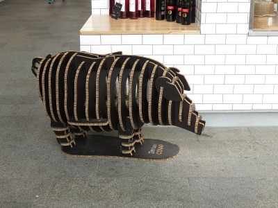 A mascot for the pork and sausage stand