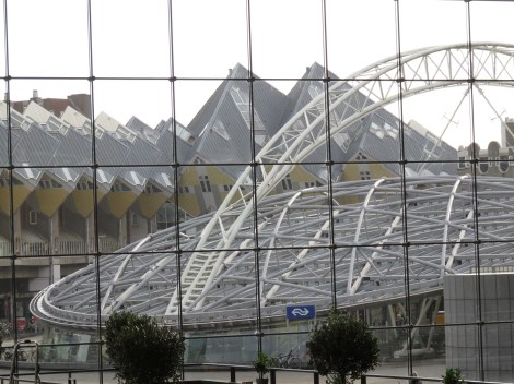 A view through the front facade shows the famed Kubus Houses and the Blaak metro station