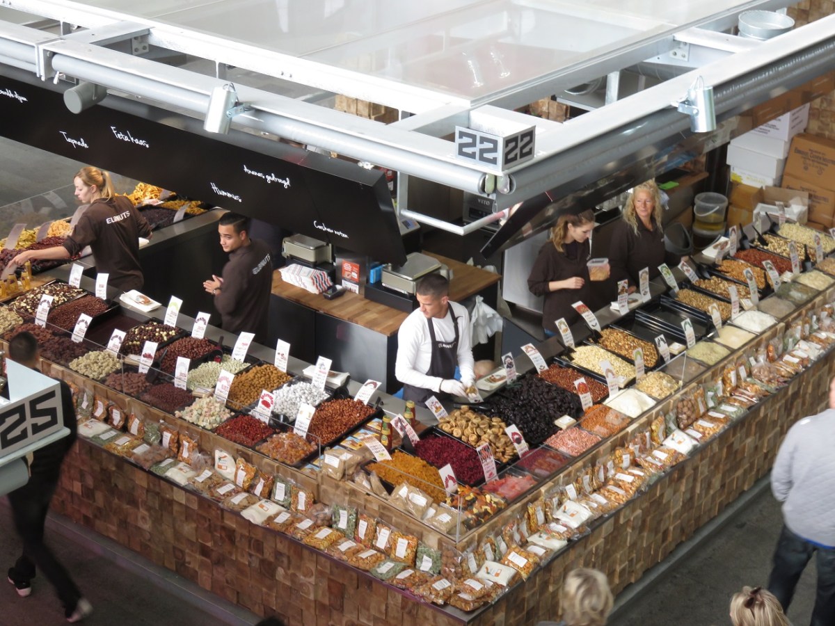 Grains and nuts in a very tidy stall, seen from a mezzanine spot