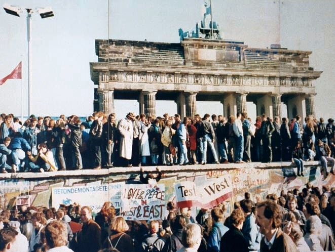 A joyous crowd atop the Berlin Wall Nov 1989. Courtesy of wikipedia