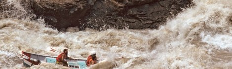 Kenton Grua (rear) hitting the Grand Canyon's Crystal Rapid with two guided clients in 1974