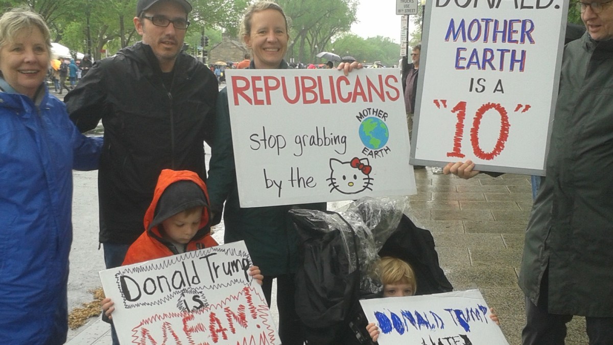 An entire family, all with signs, at the DC March for Science, just outside the National Mall.