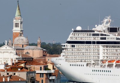 The MSC Musica cruise ship is seen in Venice lagoon in this June 16, 2012 file photo. Big cruise ships will be barred from Venice's Saint Mark's lagoon, to protect Italy's floating city from potential damage caused by growing traffic, the government said on August 8, 2014. REUTERS/Stefano Rellandini/Files