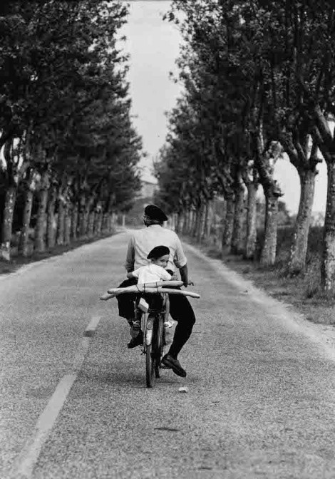Boy on bicycle. Photograph by Elliott Erwitt.